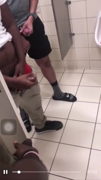 Group of horny guys stroking their cock in public toilet