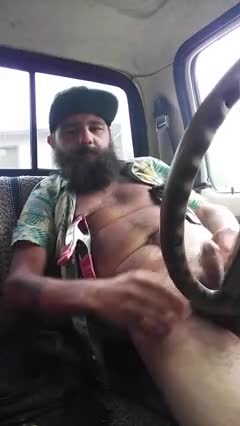 Horny trucker masturbating in front of his phone camera