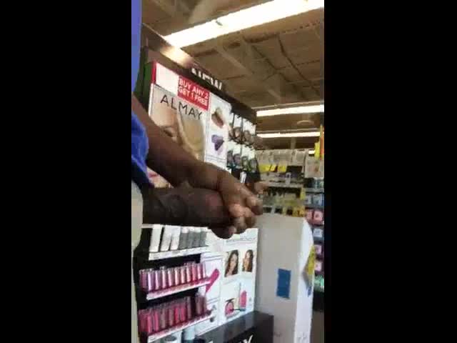 Black guy rubbing his cock in a supermarket in front of everybody